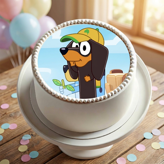 Snickers from Bluey Cake Topper shown on a cake at a birthday party